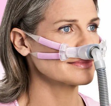 ResMed Swift FX Bella Nasal Pillow CPAP Mask on a Woman